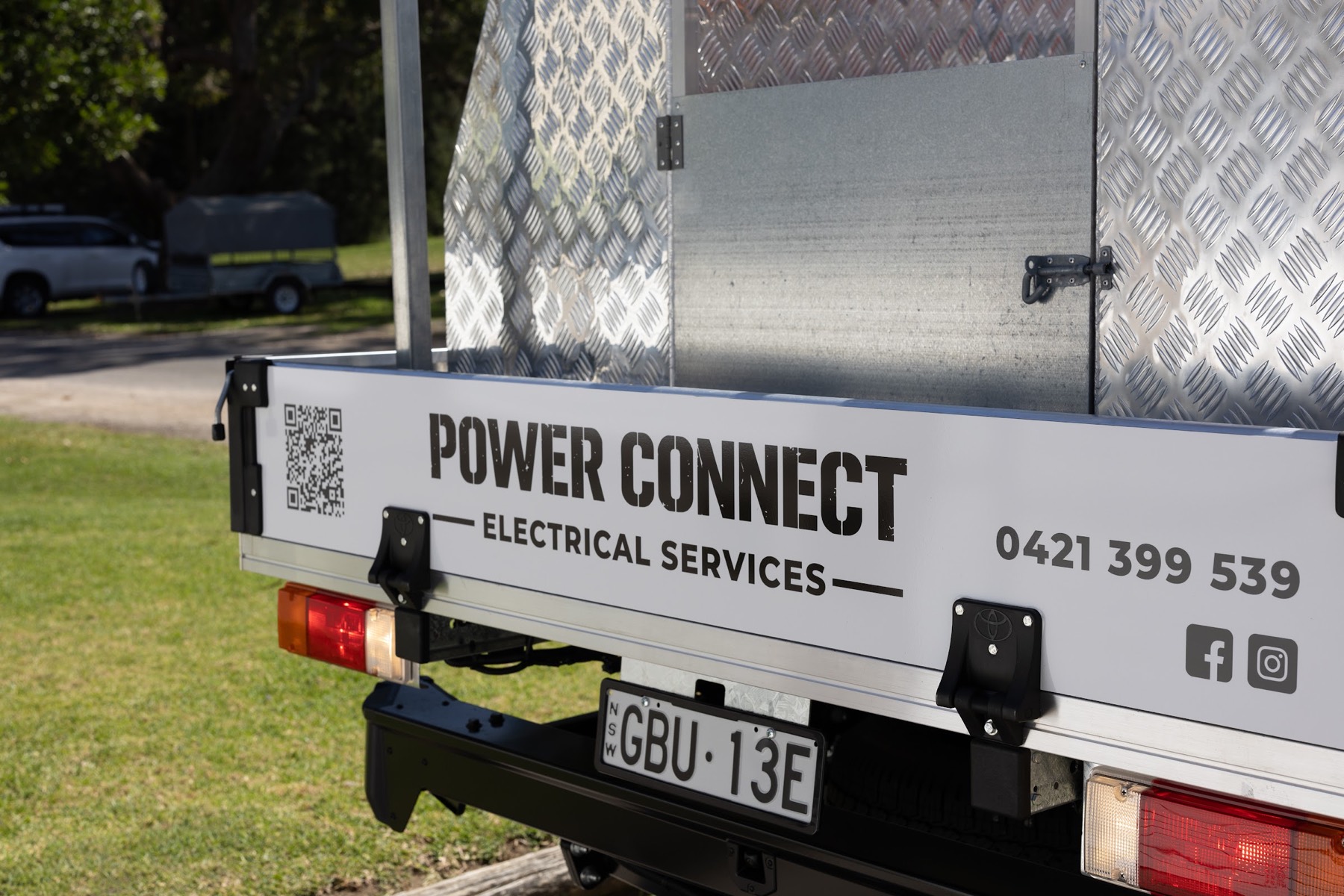 The Power Connect ute, signwritten with phone number and socials